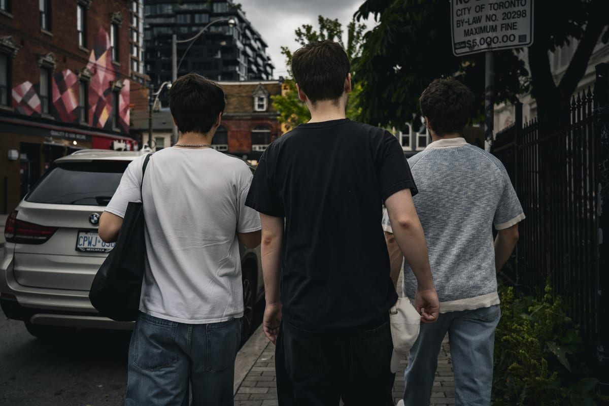 The Boys Walk the Streets of Downtown Toronto